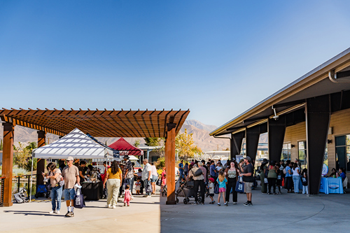 Festival participants visiting partner booths.
