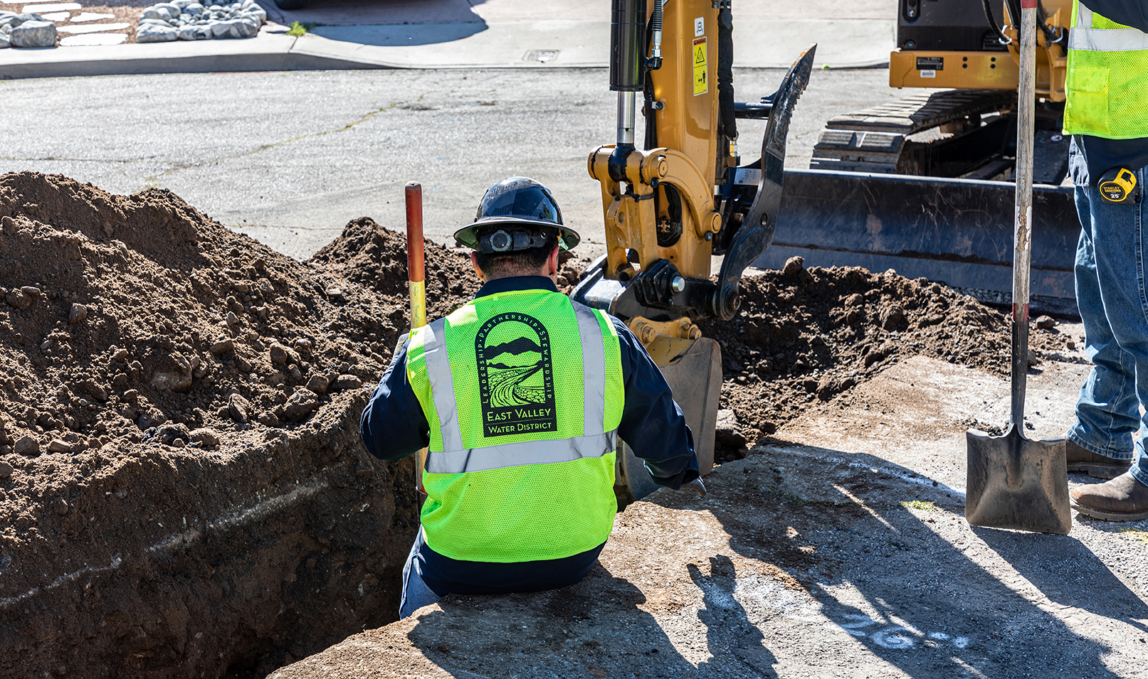 Man driving a backhoe 